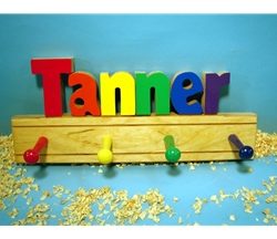 A child's coat rack with the name Tanner on it.
