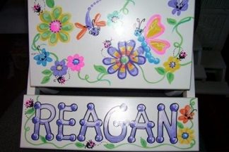 Hand painted step stool designed with dragonflies, flowers and butterflies for a child named Reagan